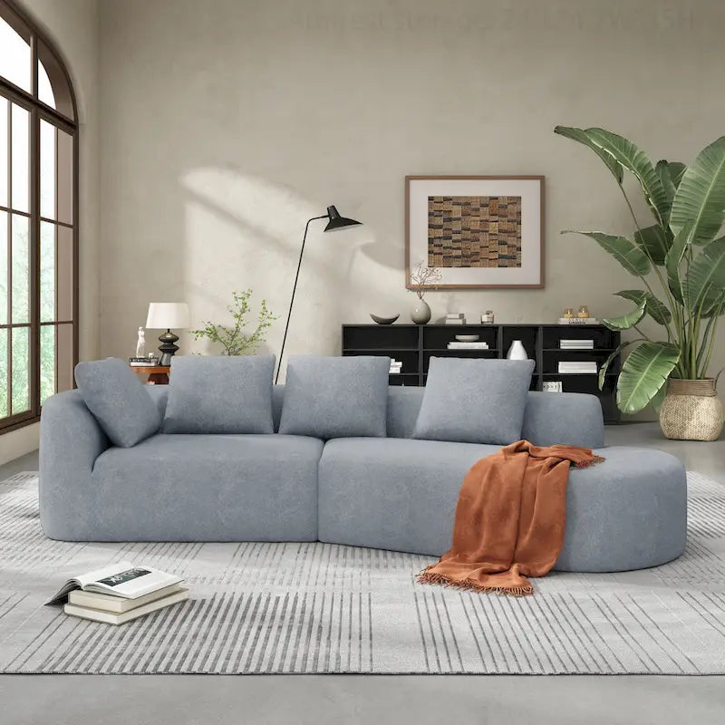 Canapé d'angle incurvé moderne avec revêtement de haute qualité et assise spacieuse